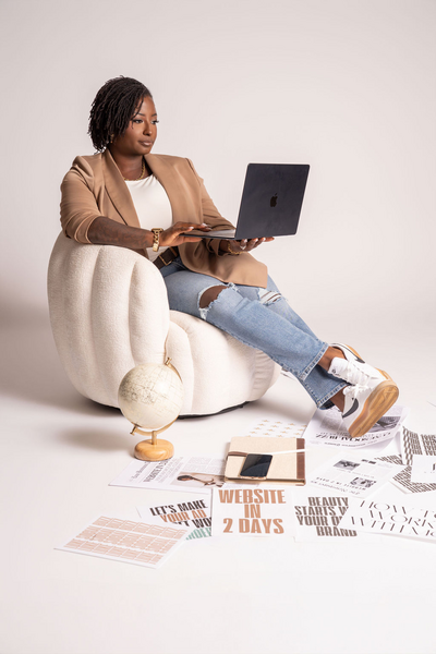 Web designer Shanika customizing Showit website layout for real estate brand.