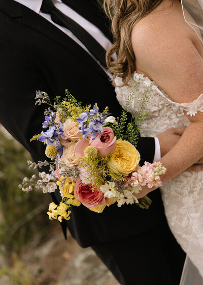 Colorful bridal bouquet in Colorado mountain wedding