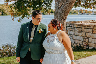 Albert lea mn bride and groom walking in front of lake - kings films