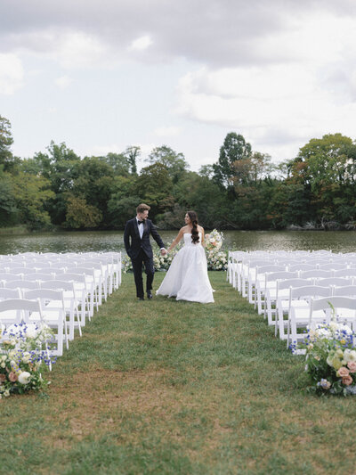 Bride and groom hugging on sailboat at Chesapeake Bay Maritime Museum