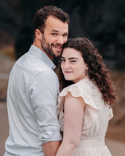 engaged couple standing together