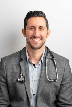 Dr. Antonio Reale, ND, MS, poses in a clinical setting, exuding professionalism