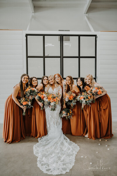 bride surrounded by bridesmaids