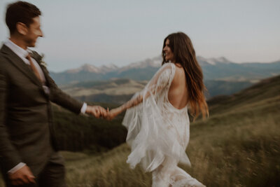 Couple dances together in the mountains