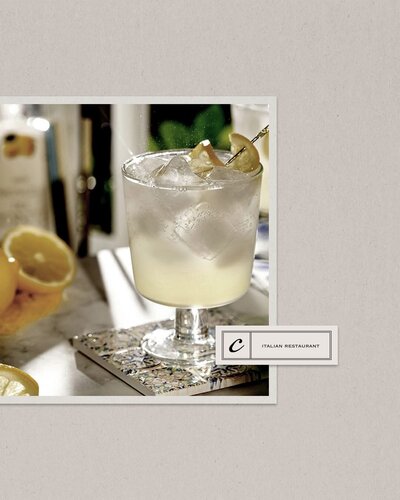 Minimalist website design for a cocktail bar with a focus on warm neutral tones and modern elegance.