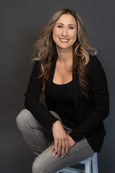 Smiling and happy a woman poses for her branding photos in Langley