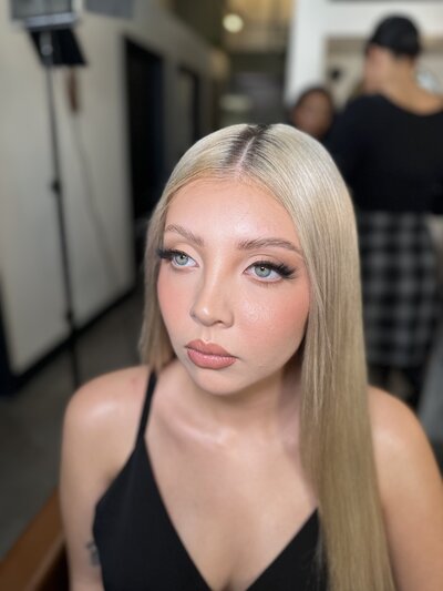 Model with natural blonde hair and glowing bridal makeup by MaKall