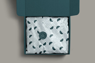 Mailer box and tissue paper packaging design for Sipsy Ink Copywriting