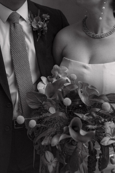 Wedding photographer captures couple taking a stroll hand in hand at their french chateau wedding.