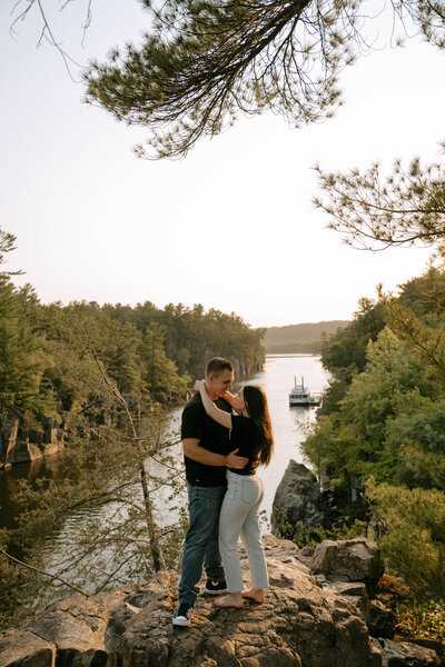 couple holding each other overlooking st.croix river