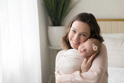 south jersey newborn photographer, Susan Hennessey photography captures a mother and newborn in studio in moorestown, NJ