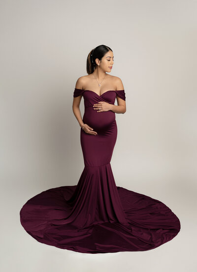 Purple metallic maternity gown with detachable long sleeves — elegant and versatile photoshoot option in Austin studio