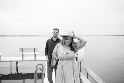 woman and man walking on a doc
