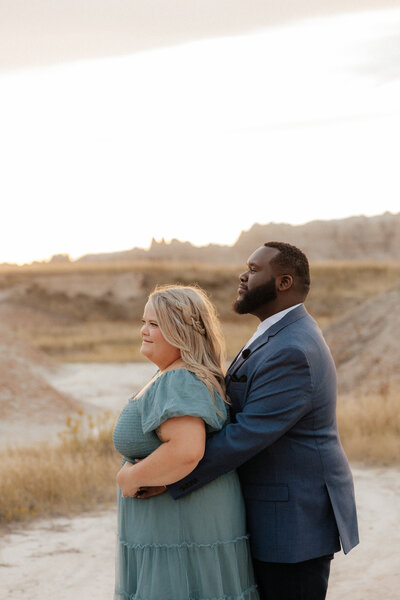 Kenyon and BreAnn looking in the distance at Badlands National Park.