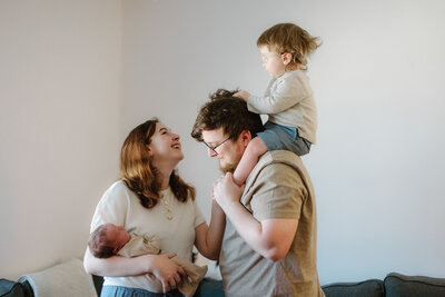 Couple posing in their home during an in home newborn photoshoot