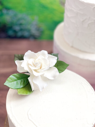 sugar flower cascade with white and gold open roses