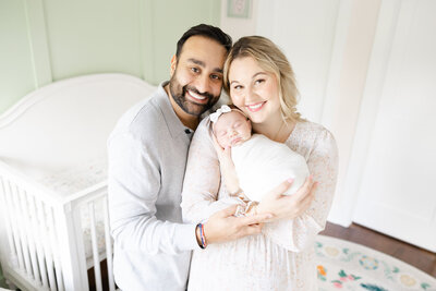 Family portrait of mom dad and baby by NOVA family photographer