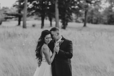 Bride and groom taking sunset photos on golf course at Solitude Links.