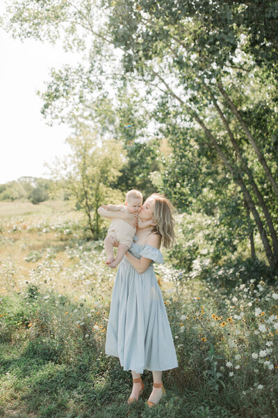 Motherhood Wisconsin field mother and baby kissing