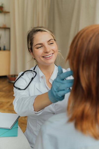  Medical aesthetics professional performing Thermage consultation showing why RN experience matters for med spa copywriting