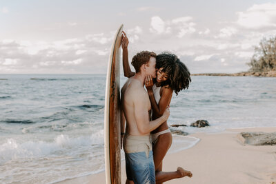 couple enjoying the beach near Haleiwa Hawaii for their engagement session