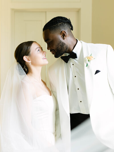 Groom holding bride and spinning her around
