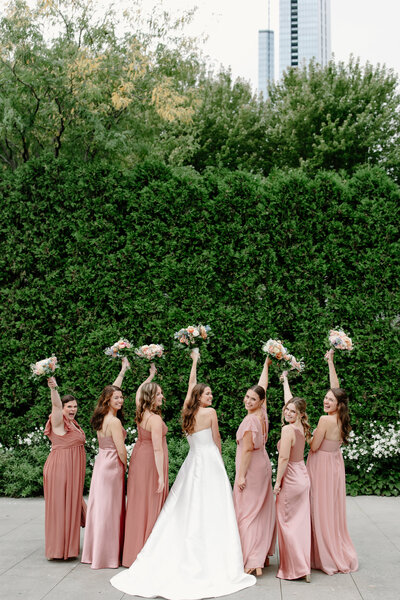 Stunning bride buckles the strap on her wedding heels