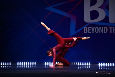 acro dancers doing a pose together on stage at thunderstruck