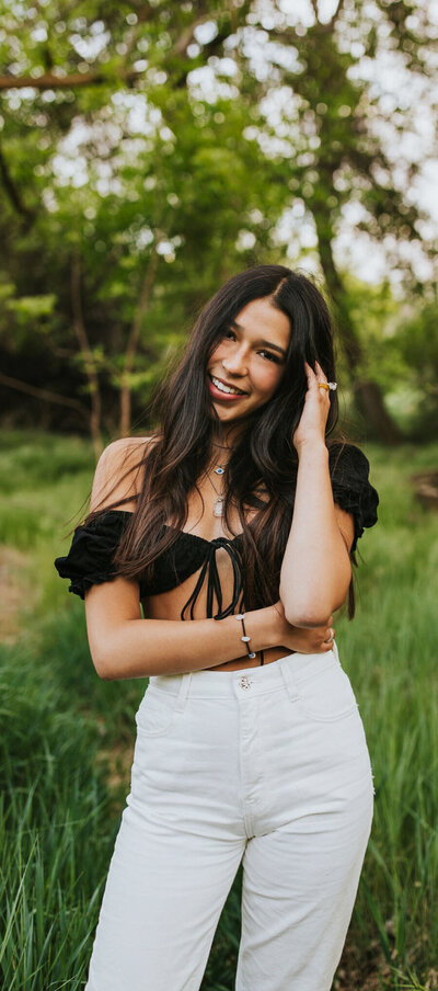 Girl in sunlit field Washington State senior session