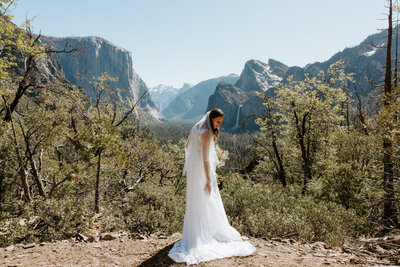Bride eloping at sunrise on a cliff in Yosemite National Park
