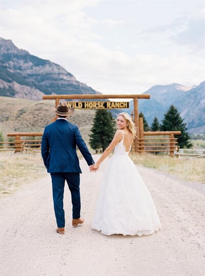 Happy couple getting married at Wild Horse Ranch in Wyoming