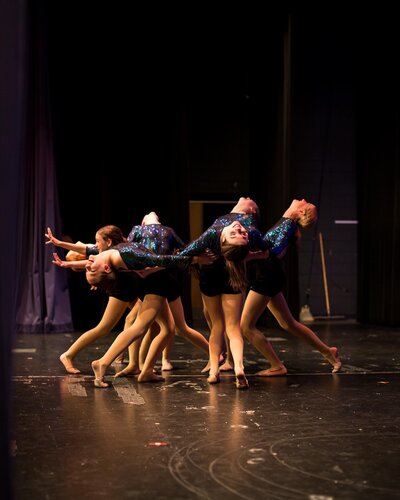 dancers doing an arch on stage together wausau