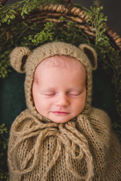 Newborn swaddled in textured wrap — refined Bay Area fine art photography