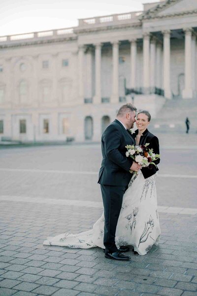 Bride and groom laughing on the capitol grounds photo taken by wedding photographer in virginia
