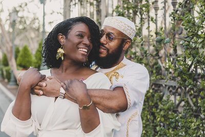 couple embraces for engagement photos in las vegas