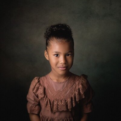 Classic children’s studio portrait in rich tones by a Michigan child photographer