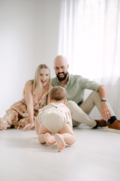 Family of five tickling each other by Miami Family Photographer