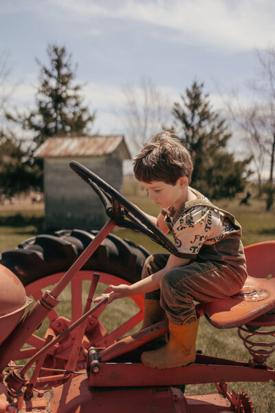 Child riding tractor at Mullberry Land Farm in Wisconsin