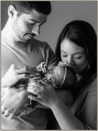 a happy couple with hands on the womans belly