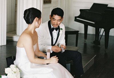 groom-and-bride-opening-gifts-jamie-park-photo