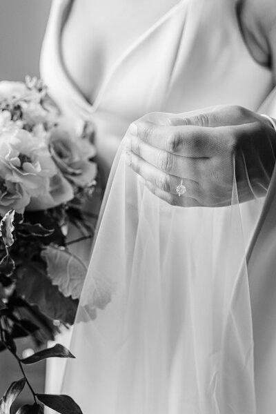 close up of a Bride holding her veil before her wedding ceremony