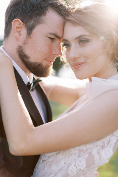 Bridal loose updo with diamond clip and florals