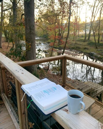 Victoria Barclay's Bible sitting next to a mug of coffee
