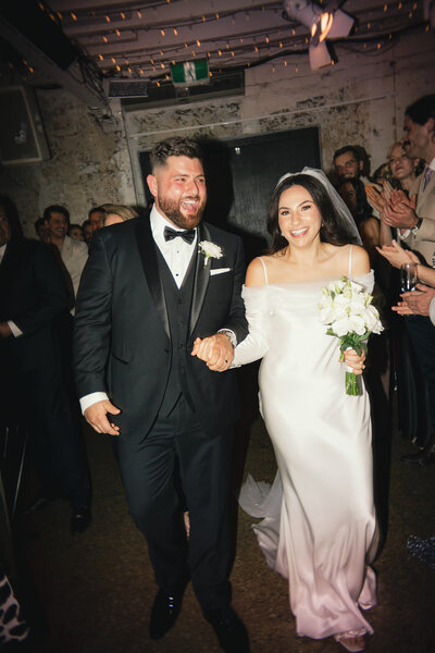 detail shots of brides perfume invitations veil and flowers