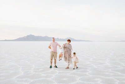 Couple with children on white sands.