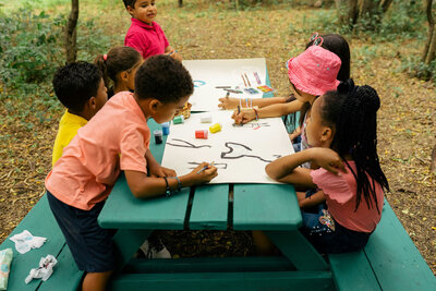 boy coloring on sheet of paper