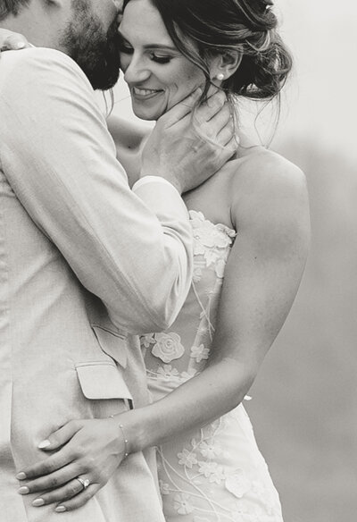 bride and groom embracing