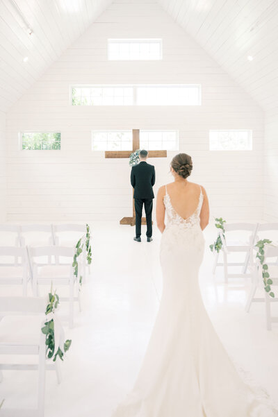 The RoseMary Wedding Venue | DFW Wedding Photographer Rae De Lain Light and Airy | Bride walks on the aisle for first look