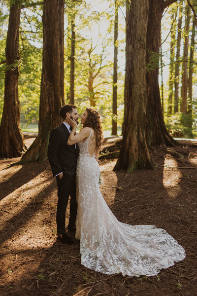Bride and Groom embrace in woods at National Arboretum