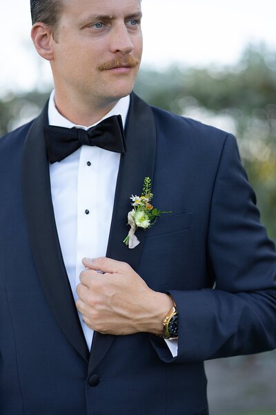 Deiderick showing his boutonniere.